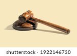 Traditional wooden judge gavel placed on round block on beige background during court