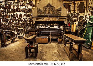 Traditional workshop for a traditional craft. Shot of a metal craftsmans workshop filled with metal tools. - Powered by Shutterstock