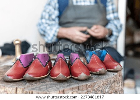 Traditional Yemeni shoes in an outdoor market stall in the city of Kahramanmaraş of Turkey country, close up