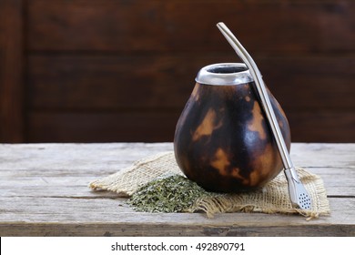 Traditional yerba mate tea in calabash mug and bombilla