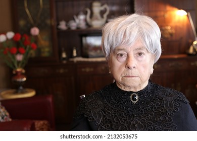 Traditionally Dressed Senior Widow With Sad Expression