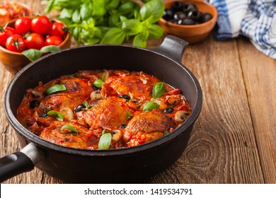 Traditionally made chicken in tomato sauce cacciatore. Front view. 
