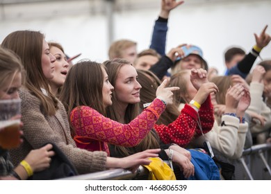 Traena, Norway - July 08 2016: audience cheering at concert of Norwegian Pop band Sno at Traenafestival, music festival taking place on the small island of Traena - Shutterstock ID 466806539