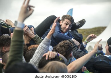 Traena, Norway - July 6 2017: Singer Of Norwegian Punk Rock Band Honningbarna Crowd Surfing At Traenafestival, Music Festival Taking Place On The Small Island Of Traena