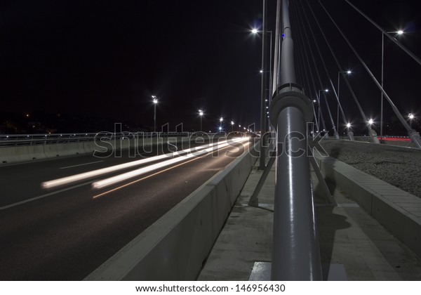 Traffic across the Bridge on Ada at nightfall, On\
Sava River, in Belgrade,\
Serbia