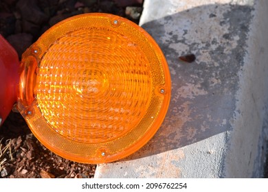 Traffic Barricade Light Lying On Curb