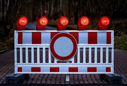Traffic Barring With Red Battery Flash Lights Indicating Road Closure, “no Entry“ Or “do Not Pass“ At Construction Sites, Accidents Or Blocked Roads. Forest Road Closed For Toad Migration In Germany.