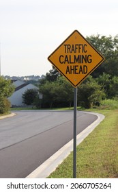 Traffic Calming Ahead Yellow Sign.