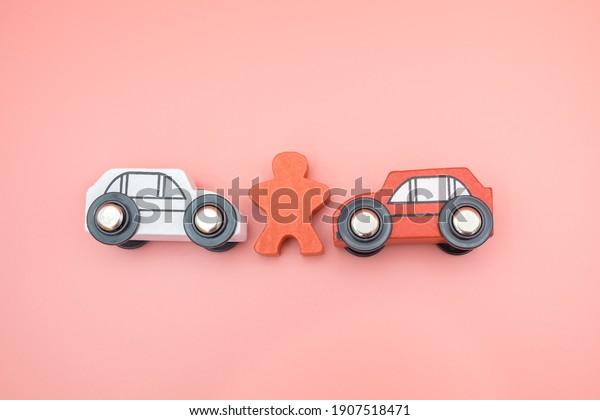 Traffic car toy accident and insurance concept on\
pink background. Agent examines and reports damage vehicle collide\
broken on the road. Investigation driver indemnity claim\
transportation. Top\
view