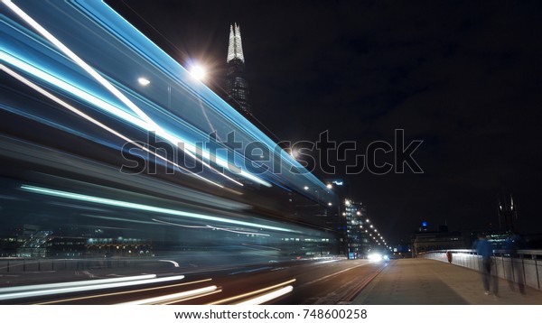 Traffic cars on London Bridge with The Shard in\
background, LONDON,\
ENGLAND