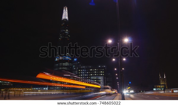 Traffic cars on London Bridge with The Shard in\
background, LONDON,\
ENGLAND