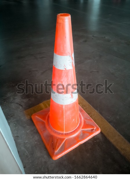 Traffic cone on concrete\
road surfaces