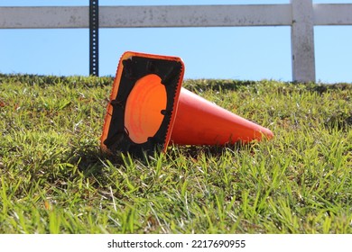 Traffic Cone On Its Side In Grass