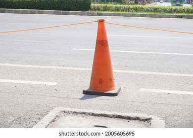 Traffic Cone On The Side Of The Road In Jakarta During The Day