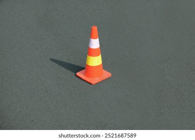 a traffic cone is placed in the middle of the road