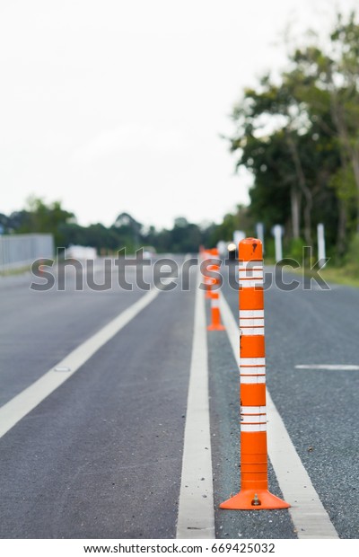 Traffic cone or traffic Pole on the road, Orange\
traffic pole