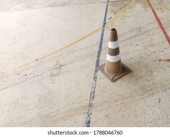 Traffic Cone Put On Cement Floor With Blurred Background Of Fork Lift In Driver Training Area, Outdoor Forklift Training Class In Factory