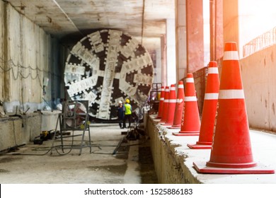 
Traffic cone for safety warning at  underground tunnel construction at working shaft.Transport infrastructure pipeline by Tunnel Boring Machine(TBM) method for electric train subway.