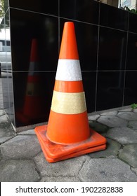 Traffic cone is a temporary traffic control device in the form of a cone made of plastic or rubber. Widely used to direct traffic to avoid sections of the road that are under repair or divert traffic.