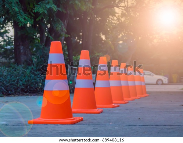 Chinese Girl Sits On Traffic Cone