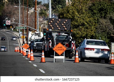 Traffic Cones In A Line Closing A Right Lane Closed Sign And Electronic Traffic Arrow 