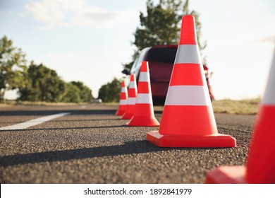 Traffic Cones Near Car Outdoors. Driving School Exam