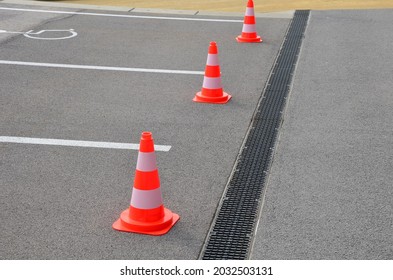 Traffic Cones Are A Necessary Aid, Especially When Repairing Roads And Sidewalks, Warning Drivers And Pedestrians Of An Obstacle On The Road, Earthworks.