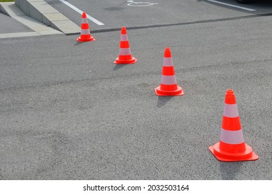 Traffic Cones Are A Necessary Aid, Especially When Repairing Roads And Sidewalks, Warning Drivers And Pedestrians Of An Obstacle On The Road, Earthworks.