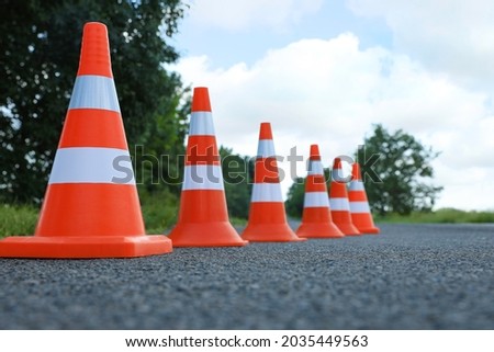 Traffic cones on asphalt highway. Road repair