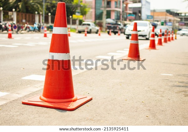 Traffic cones are placed on\
the road.