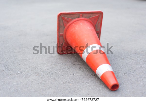 Traffic cones placed on\
the street floor.