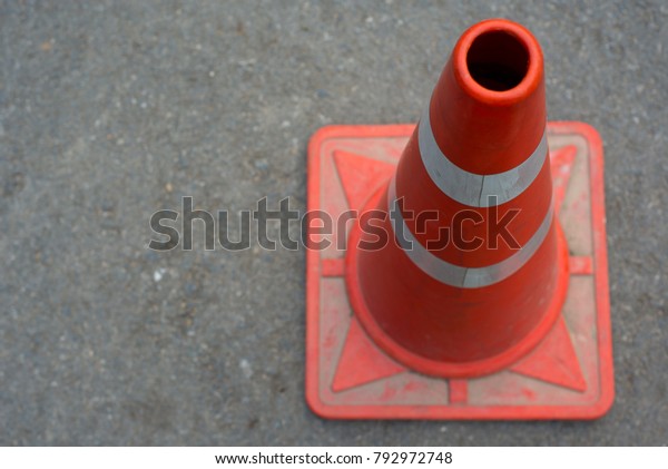 Traffic cones placed on\
the street floor.