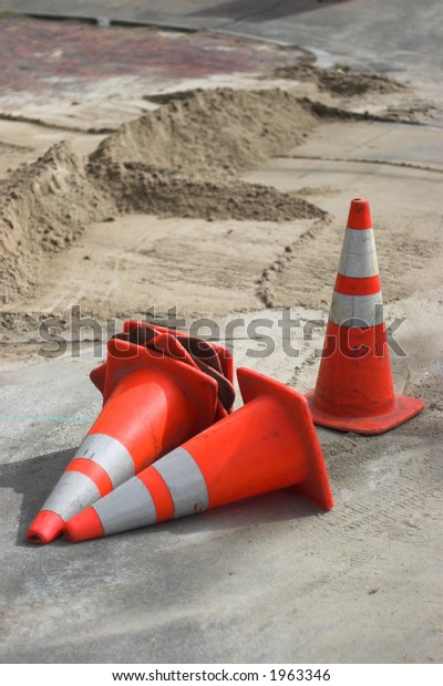 traffic cones,\
scatered on a road work\
site