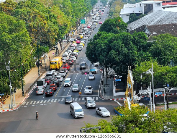 Traffic congestion and\
cars with traffic lights in the intersection, Bangkok, Thailand,\
December 2018
