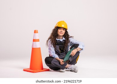 A traffic controller carrying a pylon