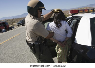 Traffic Cop Arresting Young Female Drunken Driver