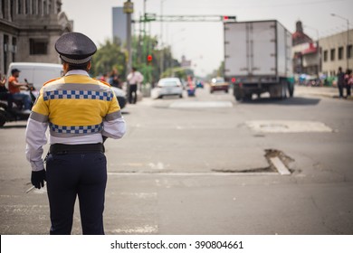 Traffic Cop Checking The Traffic In Mexico City.