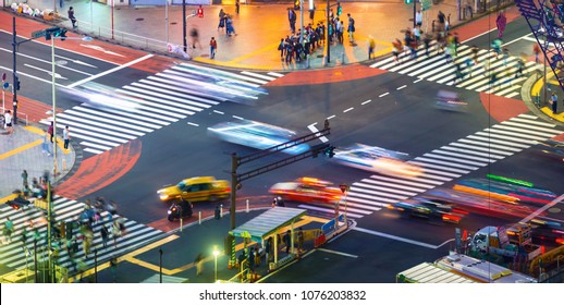 Traffic crosses a busy intersection in Shibuya, Tokyo, Japan