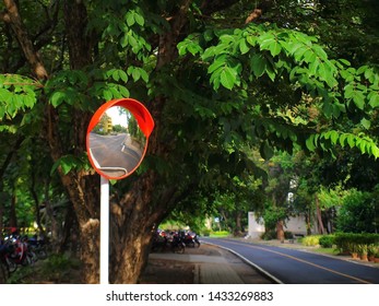 Traffic Curved Glass That Reflects The Image Of The Road Using The Intersection Or Curve For Traffic Safety With Copy Space.