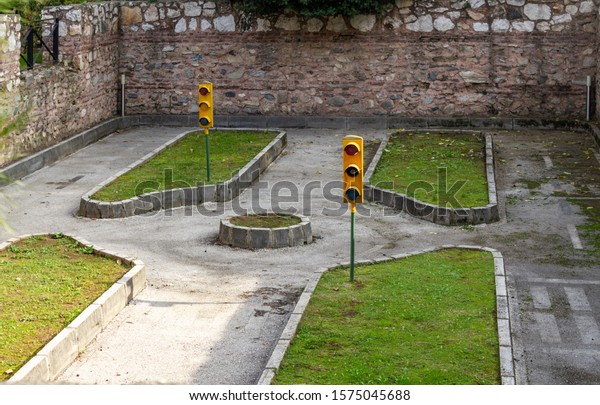 Traffic educational\
experience - practice area for children. Mini car road, traffic\
sign and traffic light