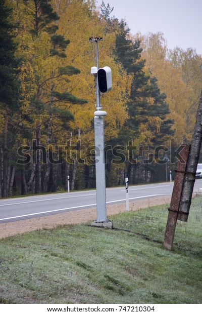 Traffic enforcement camera speed control\
radar camera at countryside road highway\
Latvia