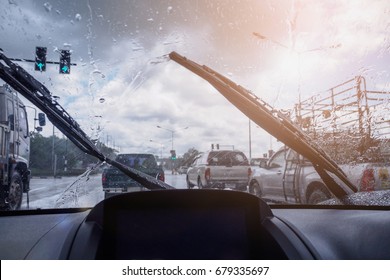 Traffic In Heavy Rainy Day With Road View Inside The Car Window With Rain Drops