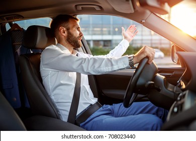 traffic jam - angry stressed businessman driving car