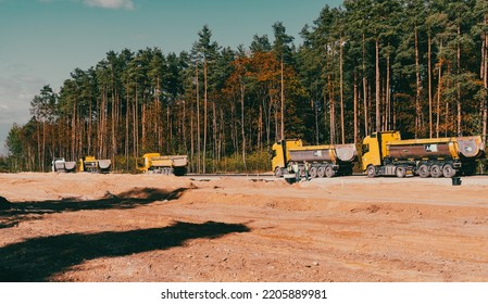 Traffic Jam With Big Trucks On The New Made Road. Building New Road. Riga, Latvia, 09.24.2022