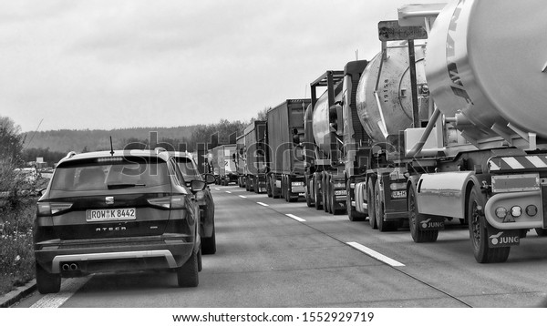 Traffic jam. Commercial vehicles. Congestion.\
Cars on a road. Black and White Photography. Germany. Munich –\
Zorneding Route  - November 20,\
2017