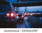 Traffic jam in evening with storm raining. people stuck on heavy traffic wet rain road in Bangkok