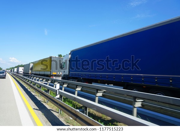 traffic jam with\
many trucks on highway\
road\
