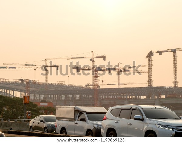 traffic jam on express way in front of big\
construction building