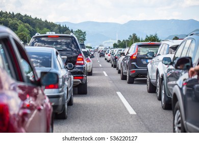 Traffic Jam On The Highway In The Summer Holiday Period Or In A Traffic Accident. 