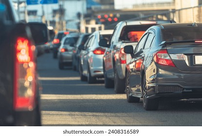 Traffic jam with a row of cars on a freeway during rush hour in the evening - Powered by Shutterstock